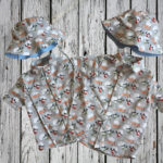 Two shirts matching shirts and hats with a helicopter design. In different sizes