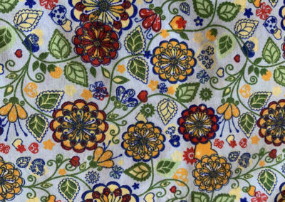 floral print with red green and yellow on light blue