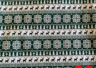 christmas print with raindeer snowflakes trees green and white